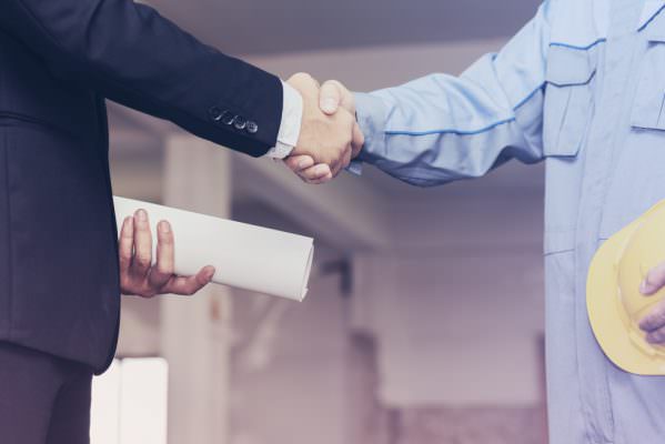 architect engineer shaking hands with businessman site 599x400 1